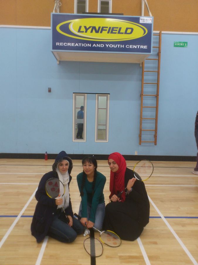 Badminton players on the court