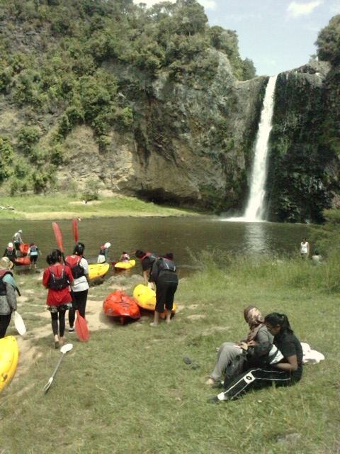 Kayaking by a waterfall