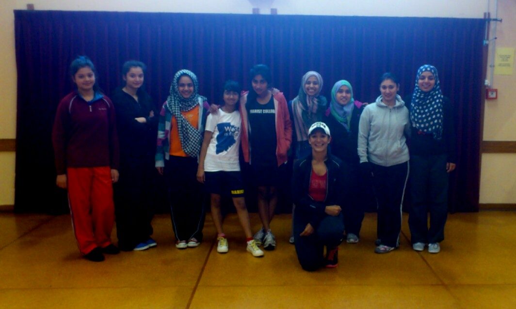 A group of young members in a sports hall